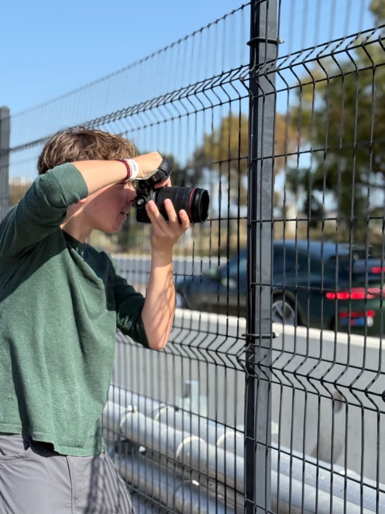 Shooting through the fence at a race track